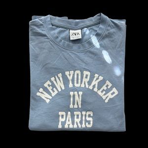 Zara Men’s Medium Light Blue “NEW YORKER IN PARIS” graphic- T-Shirt